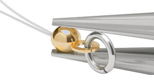 Pliers closing a bead cap with an attached jump ring